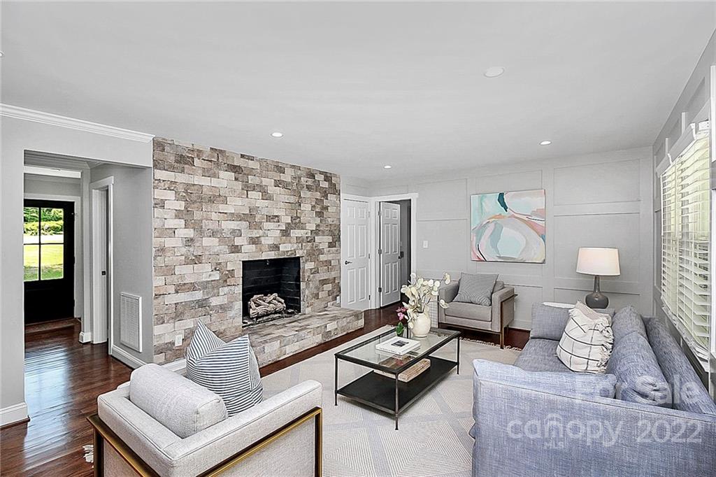 225 Morning Dale Road Matthews, NC 28105 - Photo 17 of 48 a living room with furniture and a fireplace