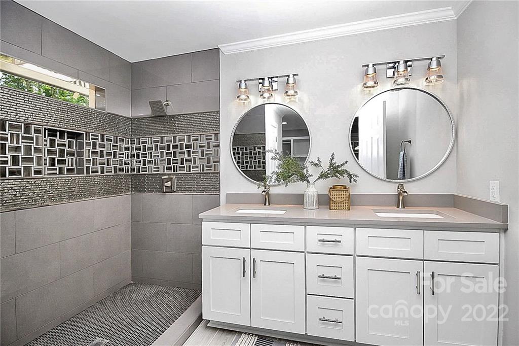 225 Morning Dale Road Matthews, NC 28105 - Photo 22 of 48 a bathroom with a sink and a mirror