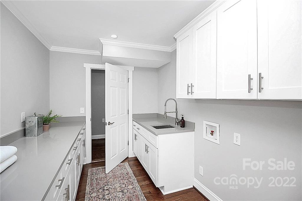 225 Morning Dale Road Matthews, NC 28105 - Photo 25 of 48 a kitchen with stainless steel appliances granite countertop a sink stove and cabinets