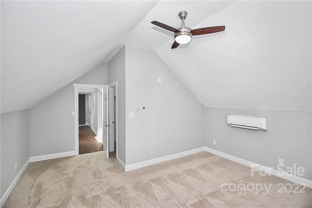 225 Morning Dale Road Matthews, NC 28105 - Photo 32 of 48 a view of a room with a ceiling fan and carpet