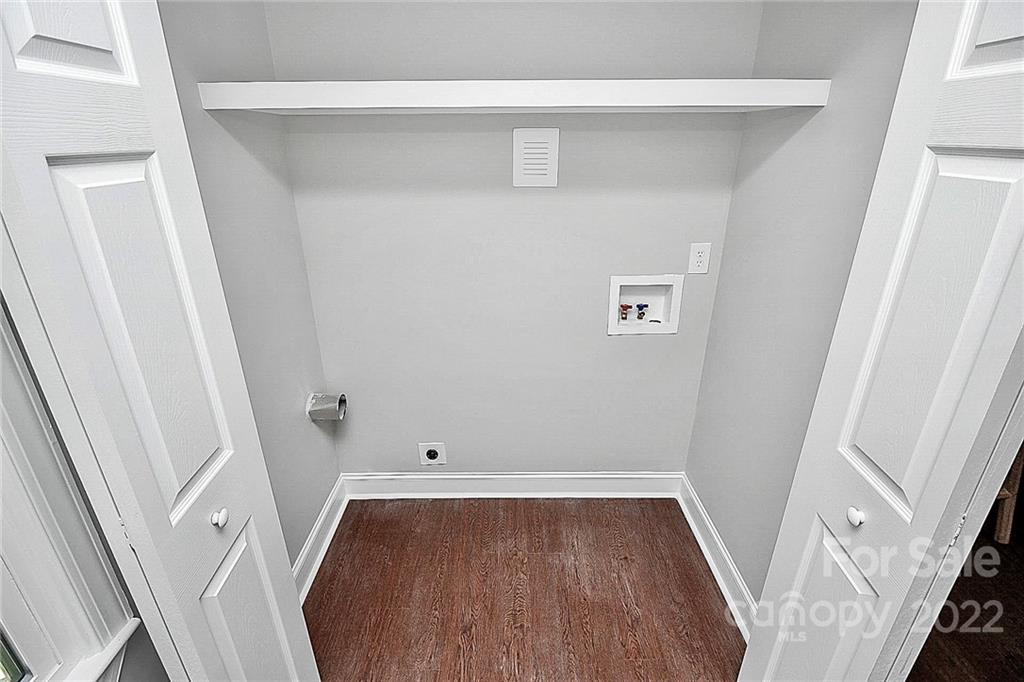 225 Morning Dale Road Matthews, NC 28105 - Photo 38 of 48 a view of walk in closet with wooden floor