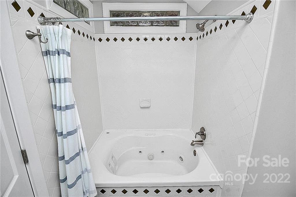 225 Morning Dale Road Matthews, NC 28105 - Photo 40 of 48 a bathroom with a bathtub