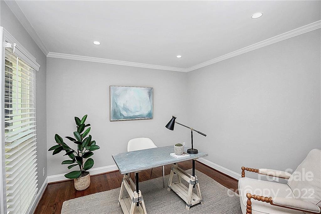 225 Morning Dale Road Matthews, NC 28105 - Photo 4 of 48 a view of a workspace with furniture and a potted plant