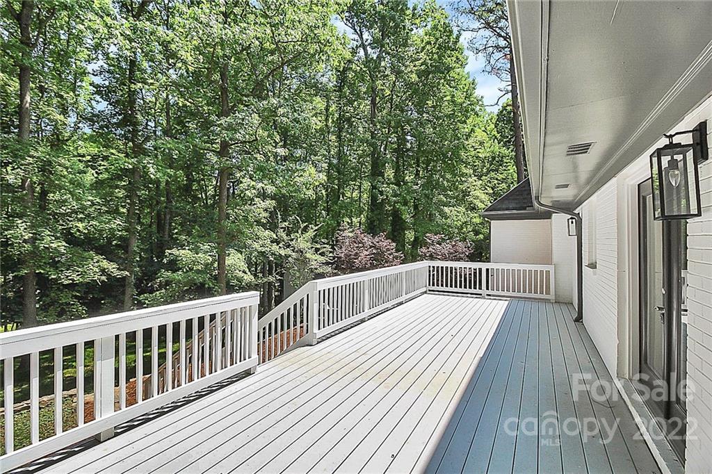 225 Morning Dale Road Matthews, NC 28105 - Photo 42 of 48 a view of balcony with wooden floor and fence