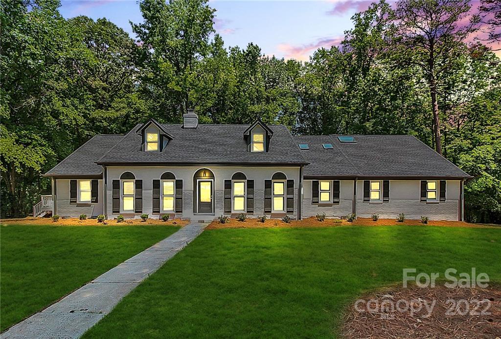 225 Morning Dale Road Matthews, NC 28105 - Photo 47 of 48 a front view of a house with a yard