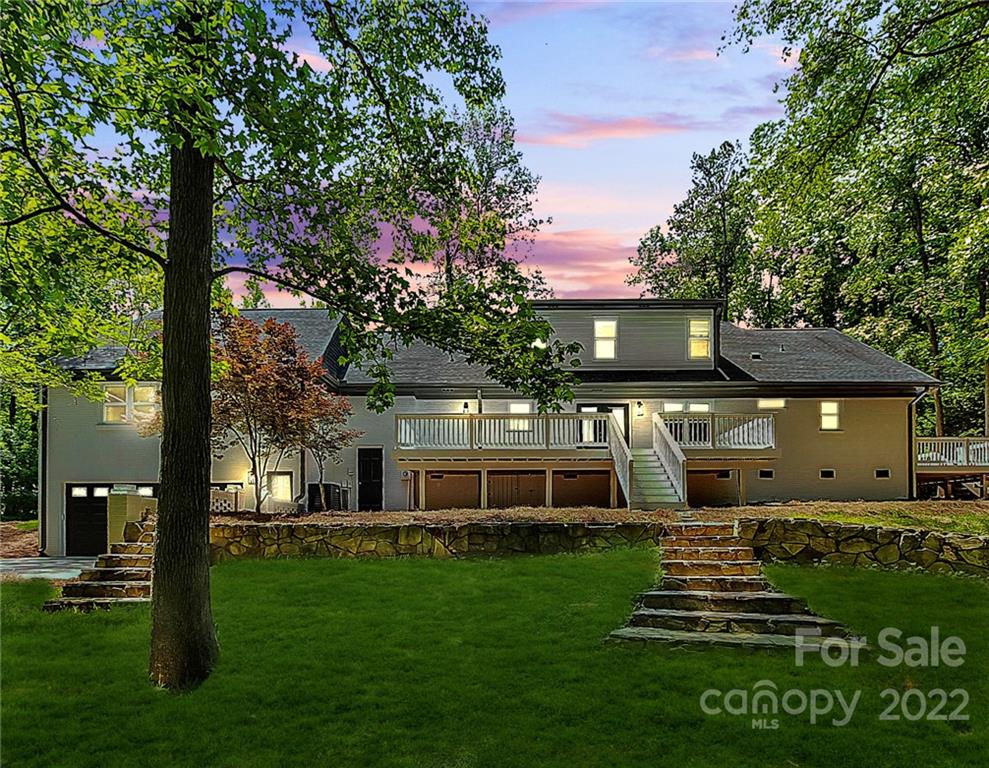 225 Morning Dale Road Matthews, NC 28105 - Photo 48 of 48 a front view of a house with a garden