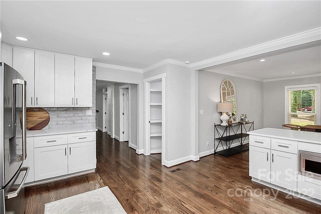 225 Morning Dale Road Matthews, NC 28105 - Photo 9 of 48 a kitchen with a sink cabinets and wooden floor