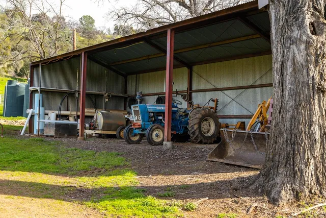 a view of a chairs and table in the patio