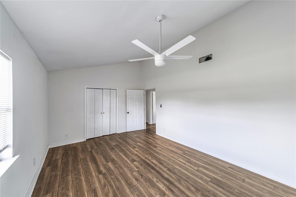 500 County Road 3724 Wills Point, TX 75169 - Photo 15 of 32 wooden floor in an empty room with a window