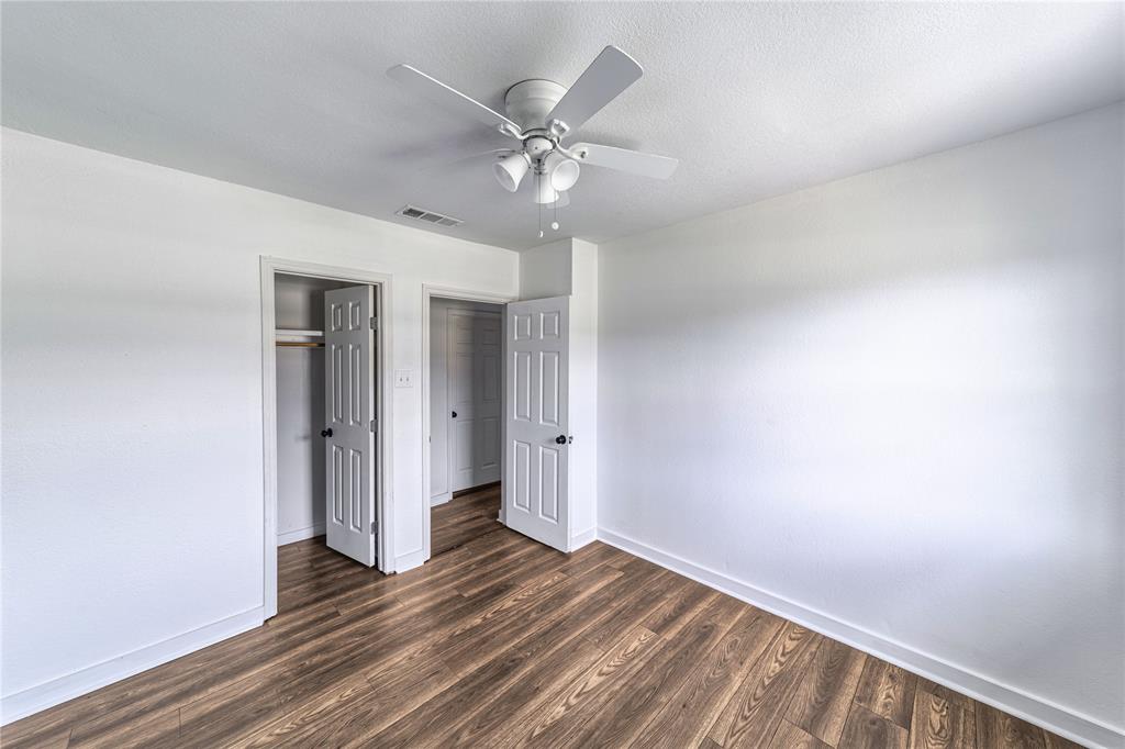 500 County Road 3724 Wills Point, TX 75169 - Photo 18 of 32 a view of a livingroom with a ceiling fan and wooden floor