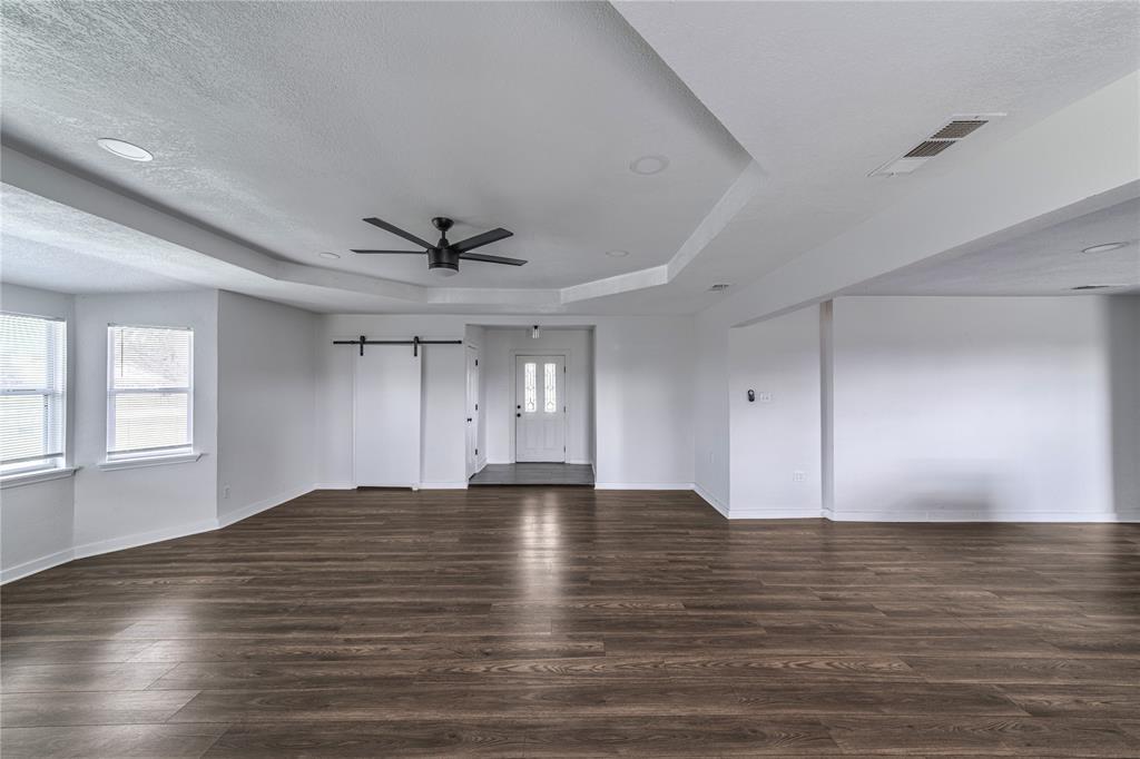 500 County Road 3724 Wills Point, TX 75169 - Photo 10 of 32 a view of an empty room with window and wooden floor