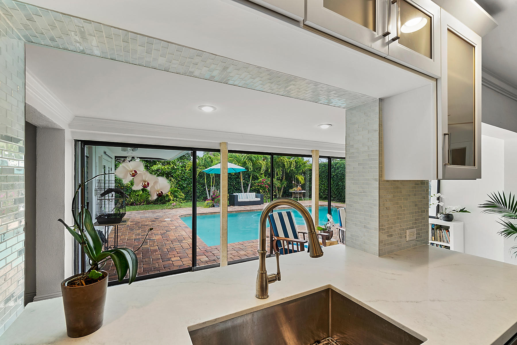 1061 Northwest 6th Street Boca Raton, FL 33486 - Photo 18 of 49 Kitchen View of Family Room and Pool