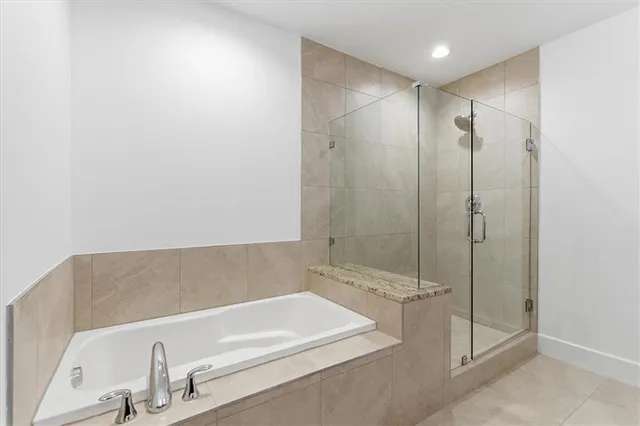 a bathroom with a shower and a sink