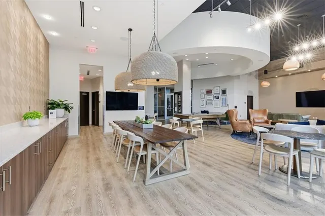 a living room with lots of furniture and a flat screen tv