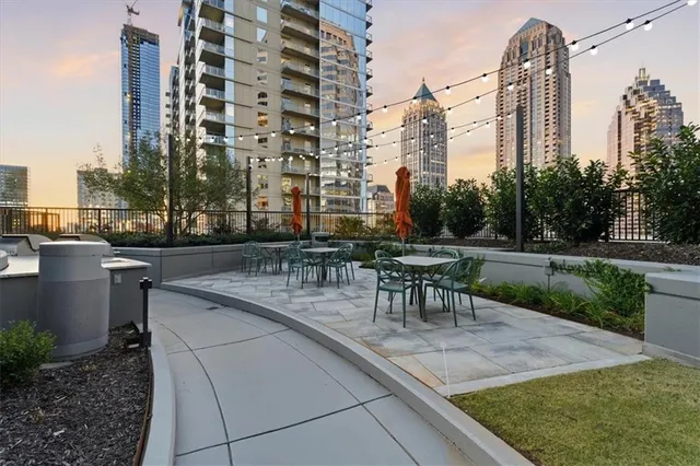 a view of a patio with a table and chairs