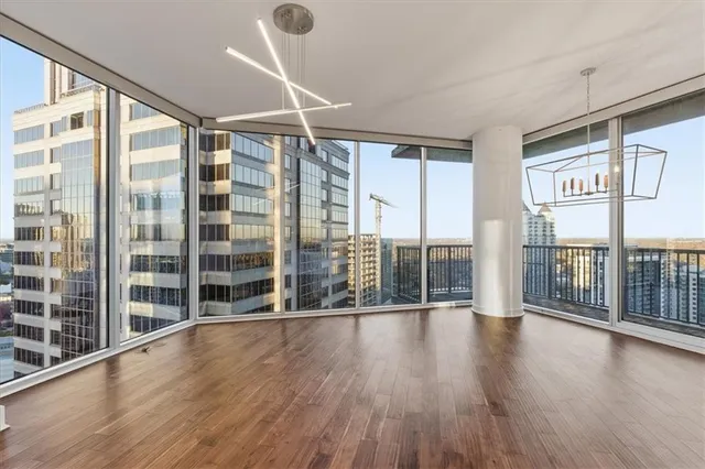 a view of an entryway with wooden floor