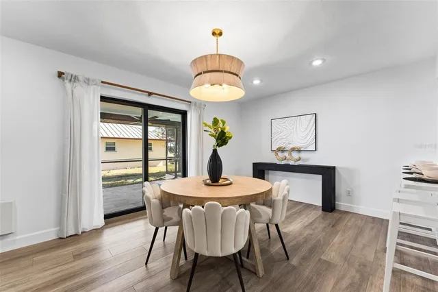 a dining room with furniture and window