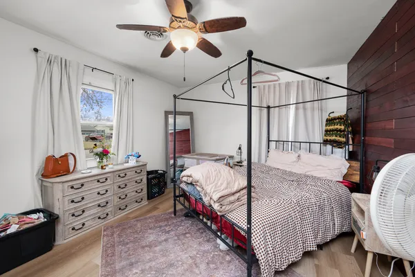 a bedroom with bed and window
