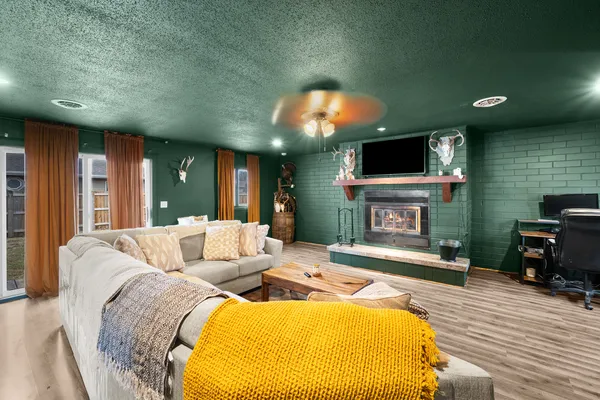 a living room with furniture and a flat screen tv