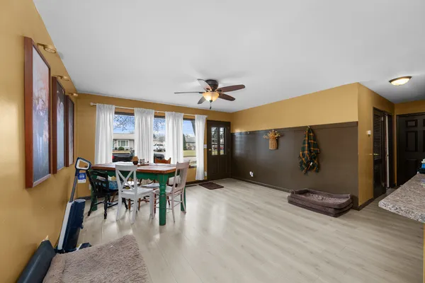 a view of a dining room with furniture window and outside view