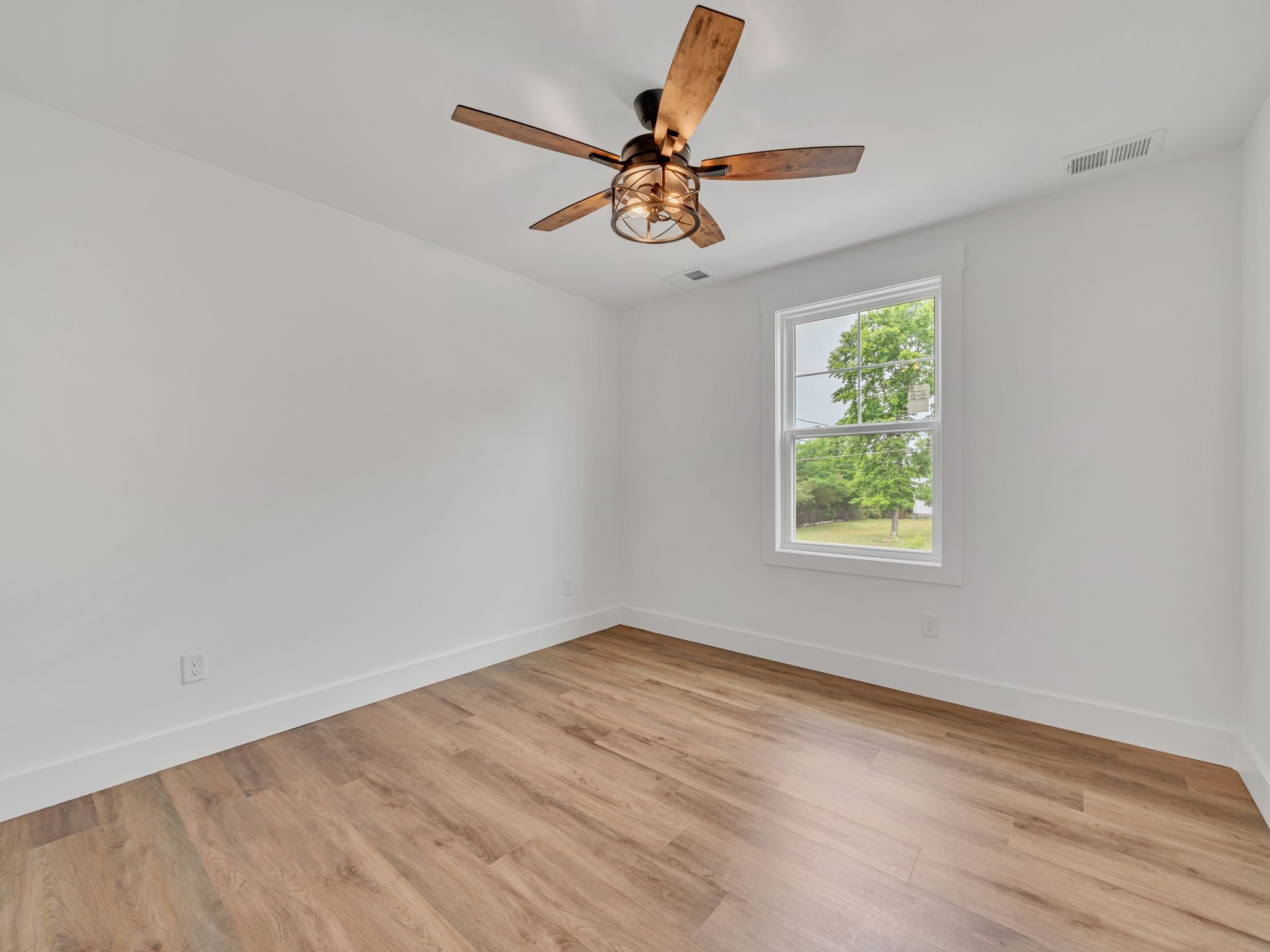 5800 Sanders Road Lyles, TN 37098 - Photo 19 of 28 wooden floor in an empty room with a window