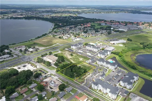 an aerial view of a house with a ocean view
