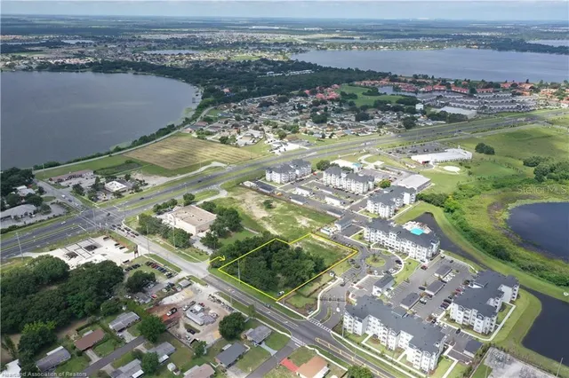 an aerial view of a house with a ocean view