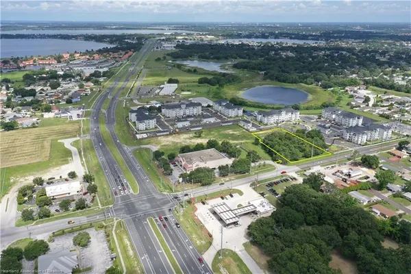 a view of swimming pool with outdoor seating and plants