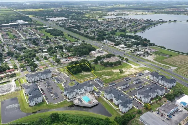 a view of a city with tall trees