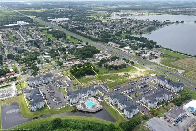 a view of a city with tall trees