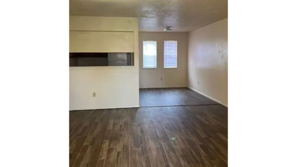 a view of a room with a wooden floor