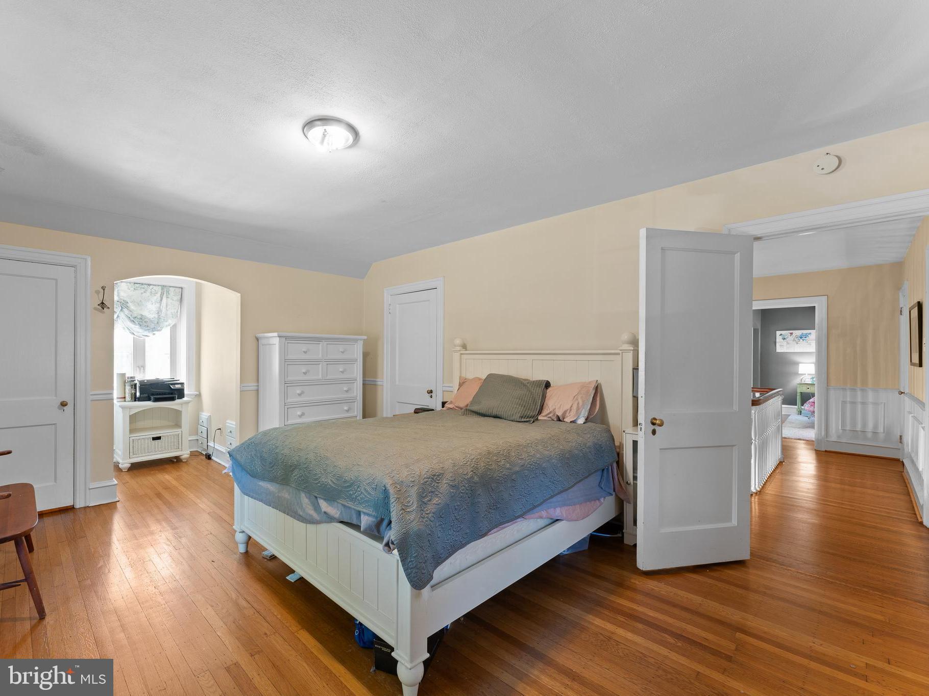 233 Shawnee Road Ardmore, PA 19003 - Photo 13 of 32 Light abounds in the primary bedroom.