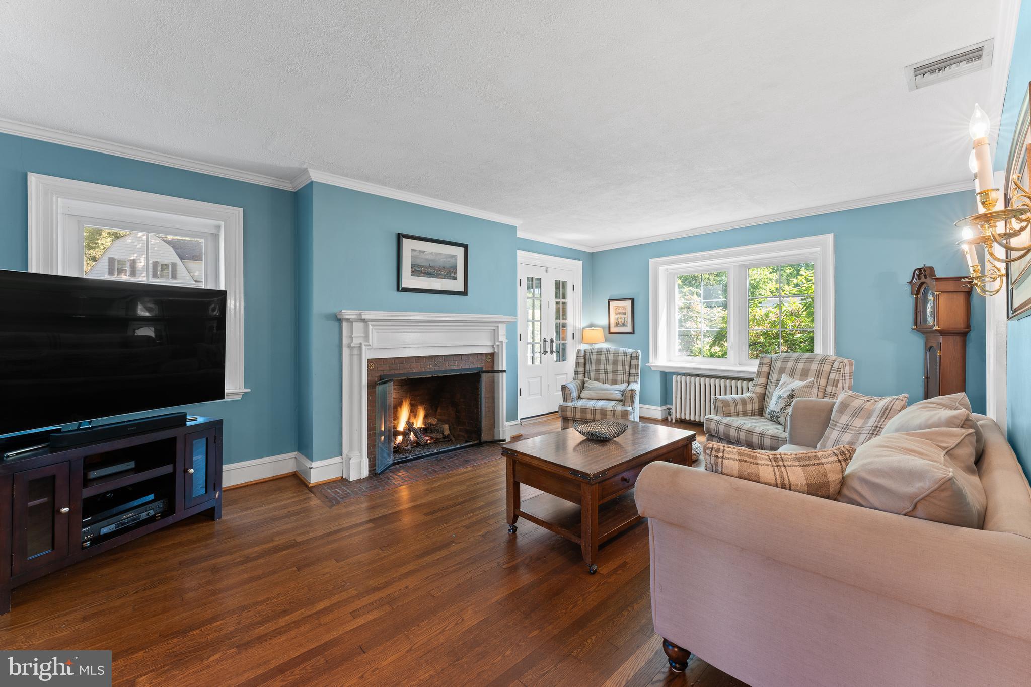 233 Shawnee Road Ardmore, PA 19003 - Photo 5 of 32 Gas fireplace in airy living room.