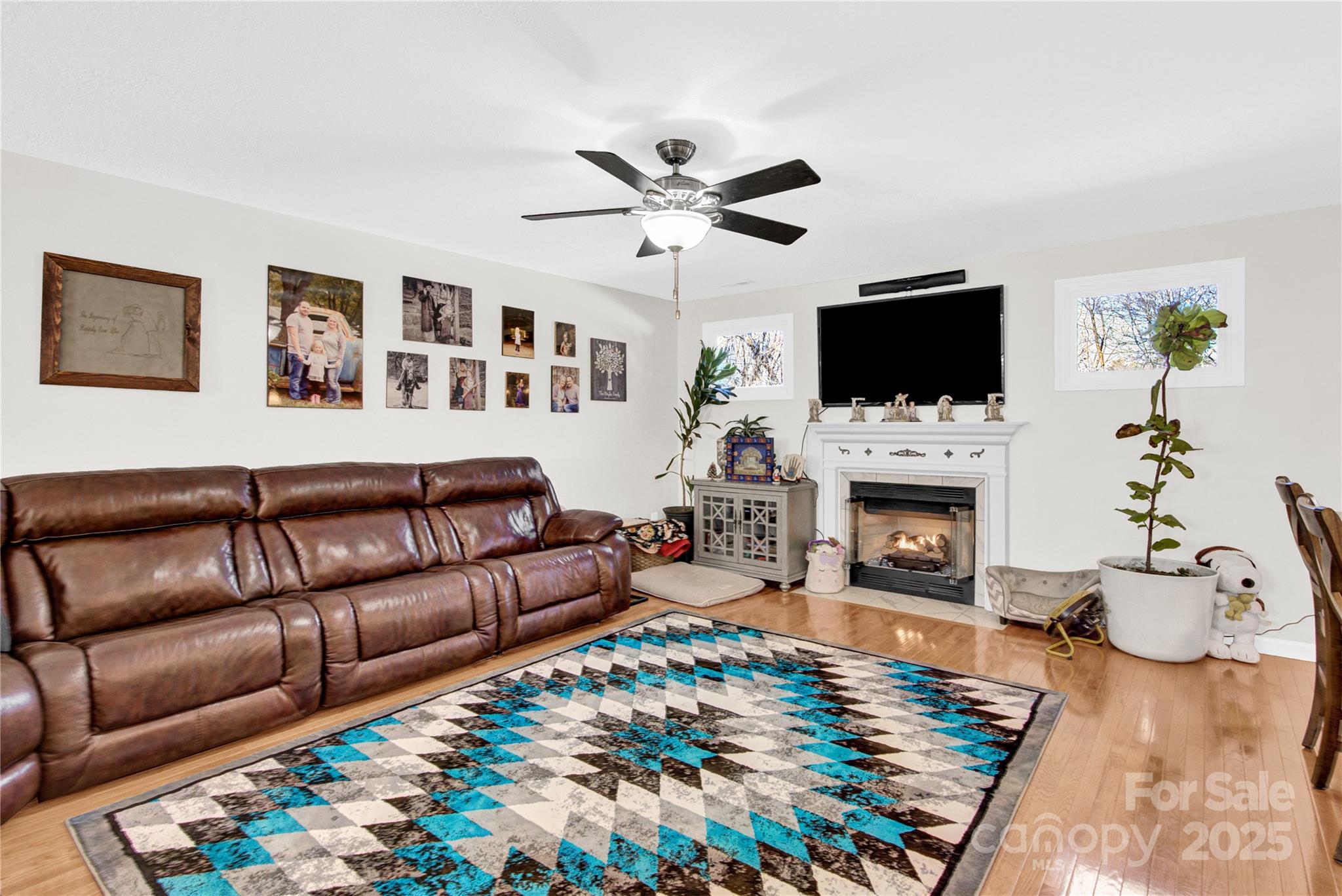 1659 Buffett Circle Hickory, NC 28602 - Photo 12 of 46 a living room with furniture a flat screen tv and a fireplace