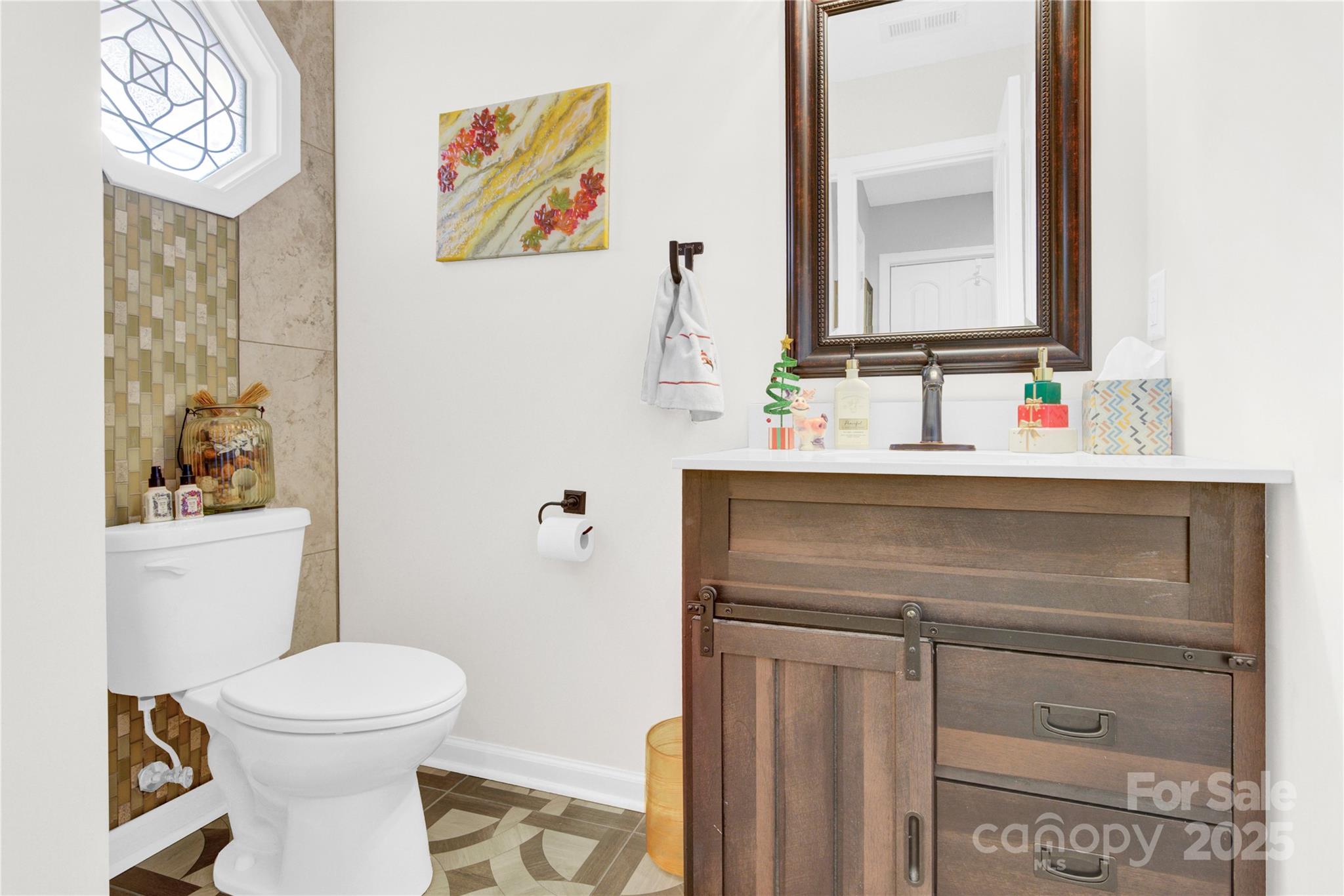1659 Buffett Circle Hickory, NC 28602 - Photo 34 of 46 a bathroom with a toilet sink and mirror