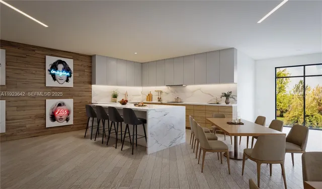 a dinning room with furniture and wooden floor