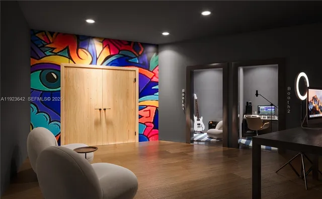 a living room with furniture and kitchen view