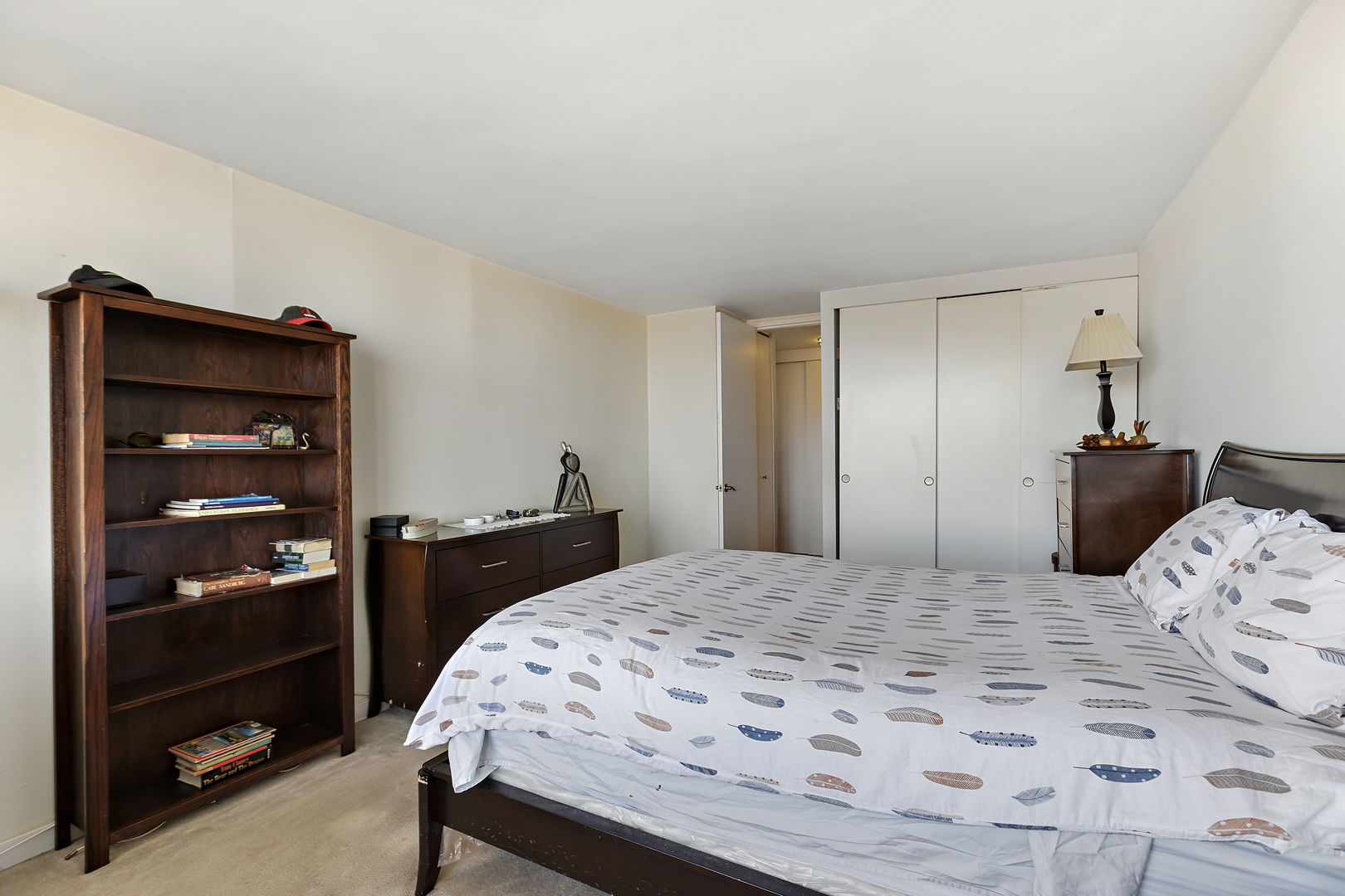 655 West Irving Park Road, Unit 1806 Chicago, IL 60613 - Photo 12 of 35 a bedroom with a bed and a cabinets