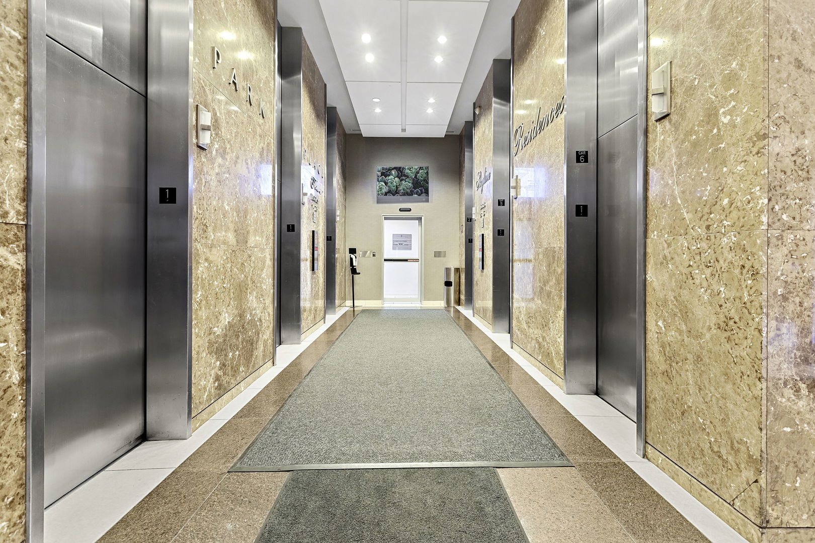 655 West Irving Park Road, Unit 1806 Chicago, IL 60613 - Photo 25 of 35 a view of a hallway with a glass door shower