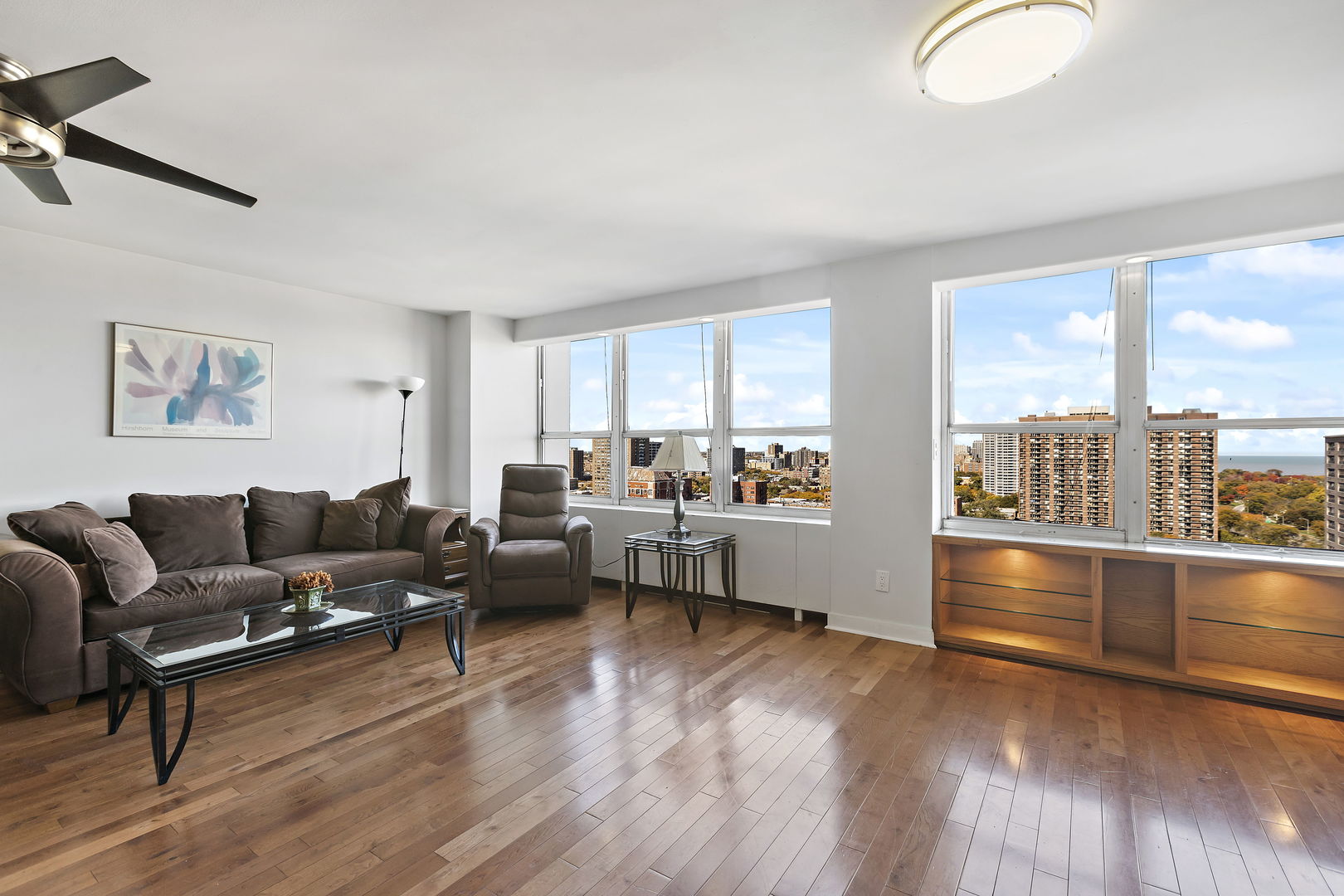 655 West Irving Park Road, Unit 1806 Chicago, IL 60613 - Photo 3 of 35 a living room with furniture and a floor to ceiling window