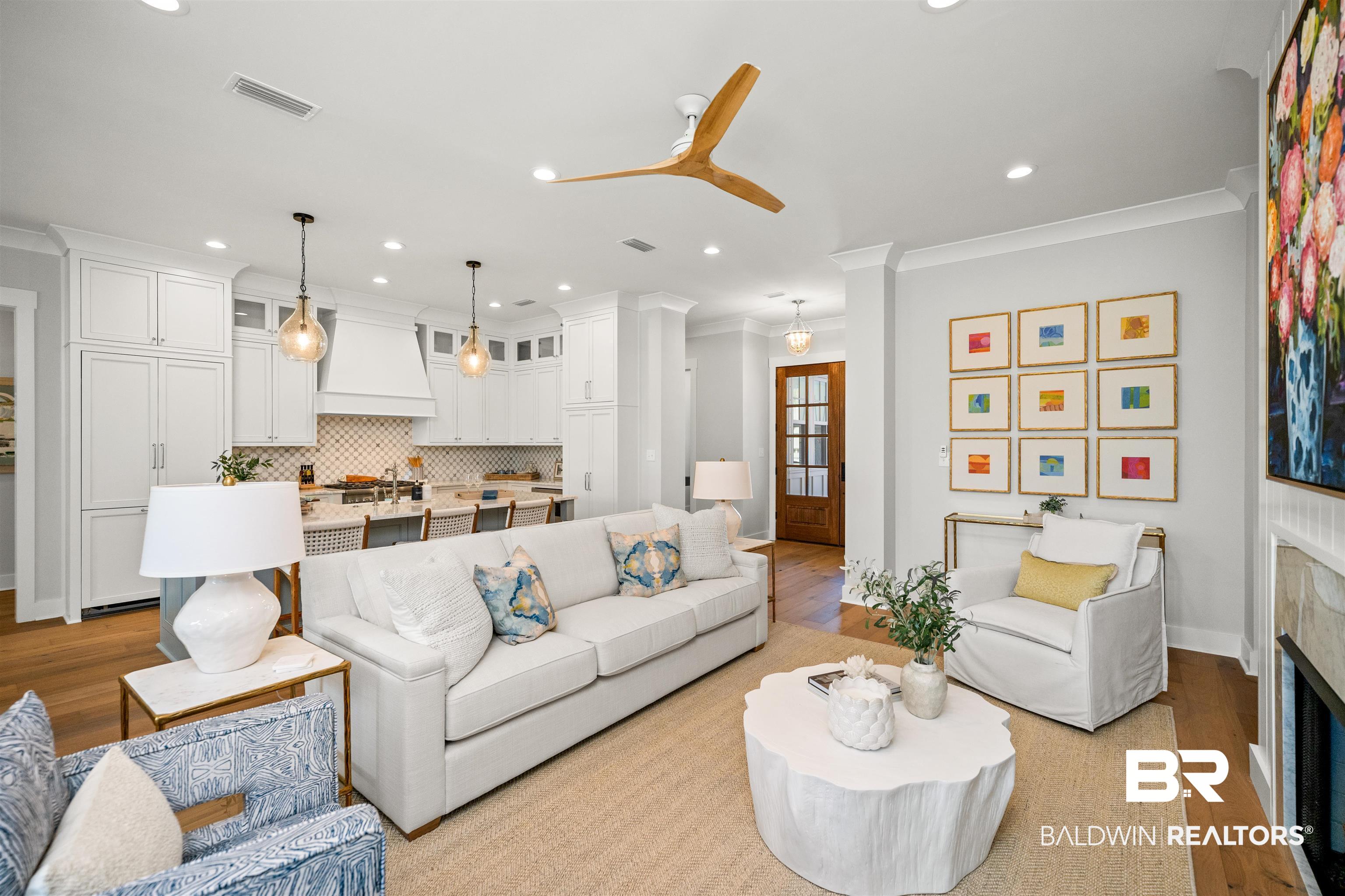 156 Hyacinth Street Fairhope, AL 36532 - Photo 7 of 61 Living area with ornamental molding, light wood-style floors, recessed lighting, a tile fireplace, and a ceiling fan