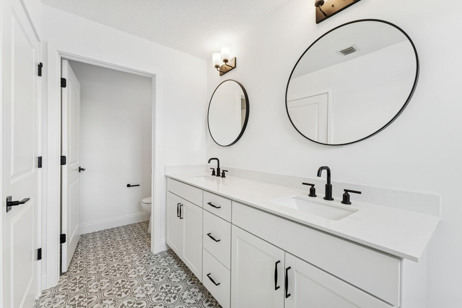 188 Southeast Birch Terrace, Unit 313 Stuart, FL 34997 - Photo 25 of 30 a bathroom with a sink and a mirror