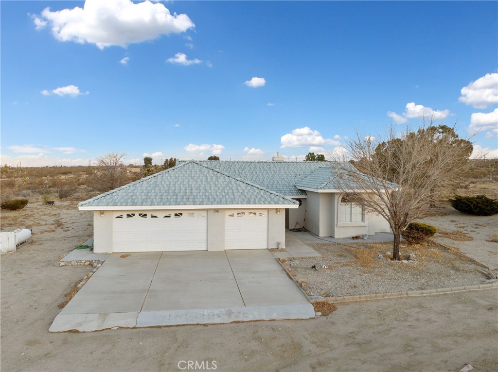12663 Mountain Road Pinon Hills, CA 92372 - Photo 1 of 1 a view of a house with a yard