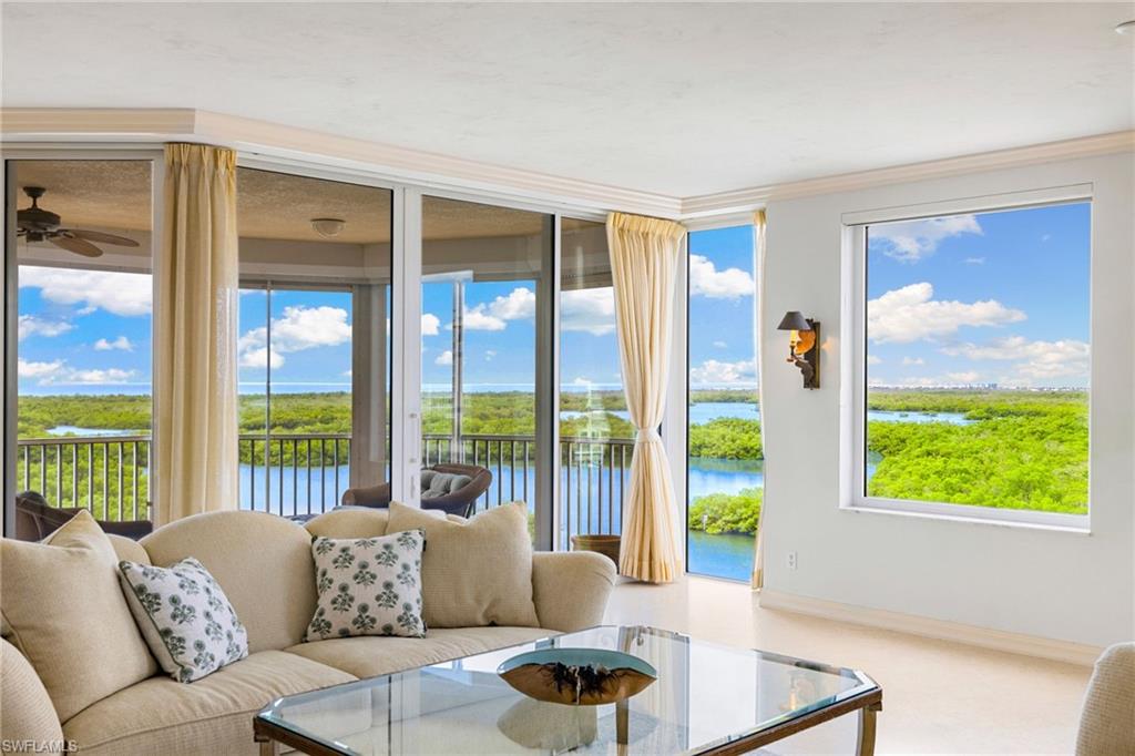 435 Dockside Drive, Unit A804 Naples, FL 34110 - Photo 14 of 50 Carpeted living area featuring a water view