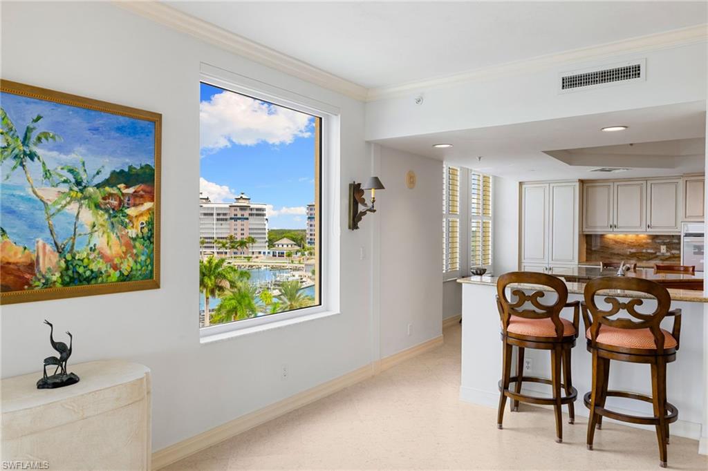 435 Dockside Drive, Unit A804 Naples, FL 34110 - Photo 15 of 50 Dining space with ornamental molding, light floors, and recessed lighting