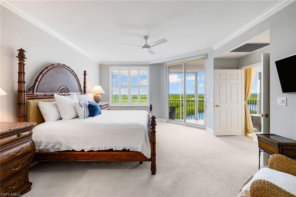 435 Dockside Drive, Unit A804 Naples, FL 34110 - Photo 20 of 50 Carpeted bedroom featuring access to outside, ornamental molding, and a ceiling fan