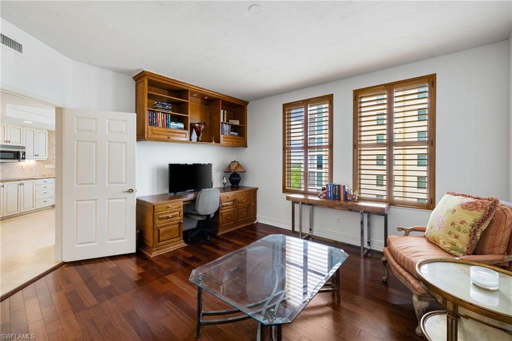 435 Dockside Drive, Unit A804 Naples, FL 34110 - Photo 25 of 50 Office with built in study area and dark wood-style flooring