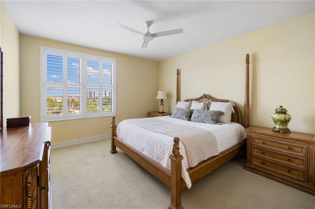 435 Dockside Drive, Unit A804 Naples, FL 34110 - Photo 27 of 50 Bedroom featuring light carpet and ceiling fan