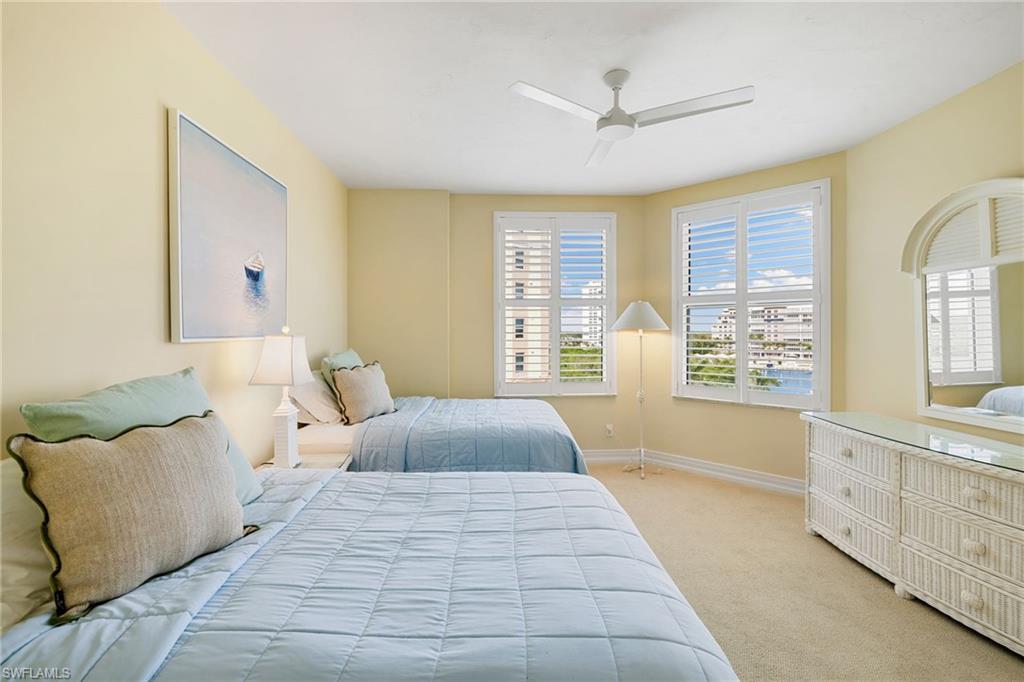 435 Dockside Drive, Unit A804 Naples, FL 34110 - Photo 31 of 50 Bedroom featuring light colored carpet and a ceiling fan