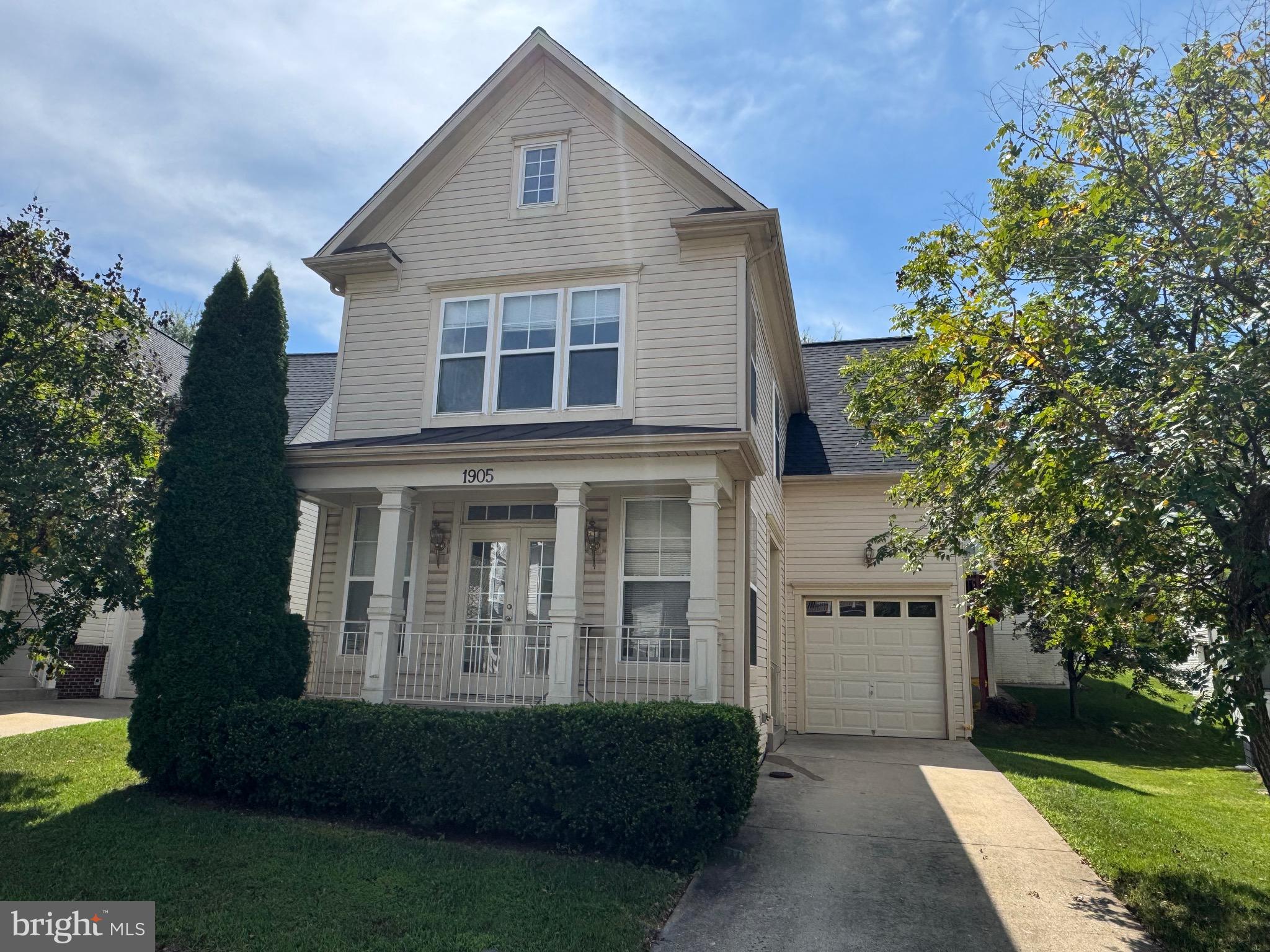 1905 Scaffold Way Odenton, MD 21113 - Photo 2 of 30 a front view of a house with a garden